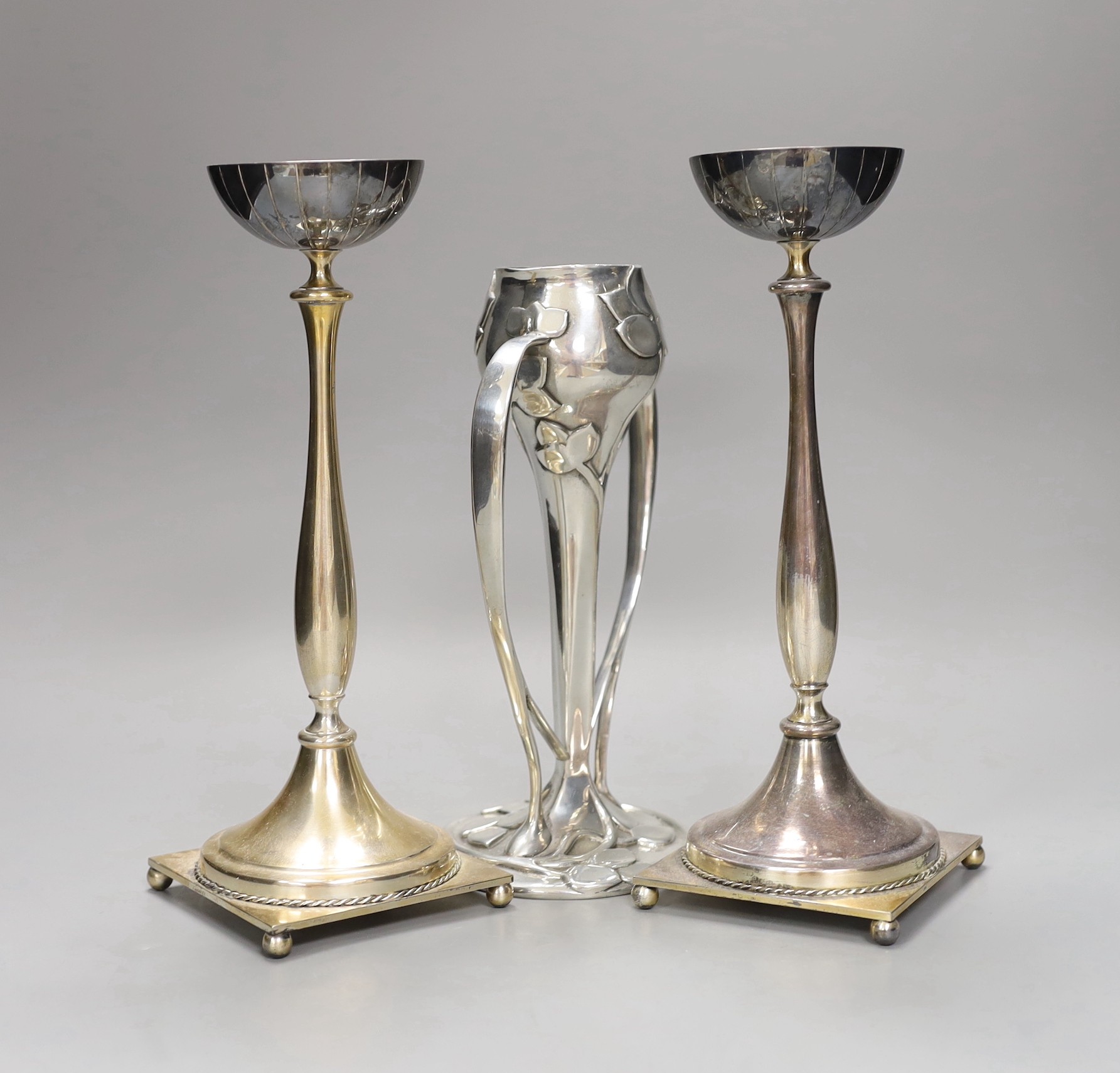 An Archibald Knox style pewter vase and two Swedish silver plated candlesticks, 26cm